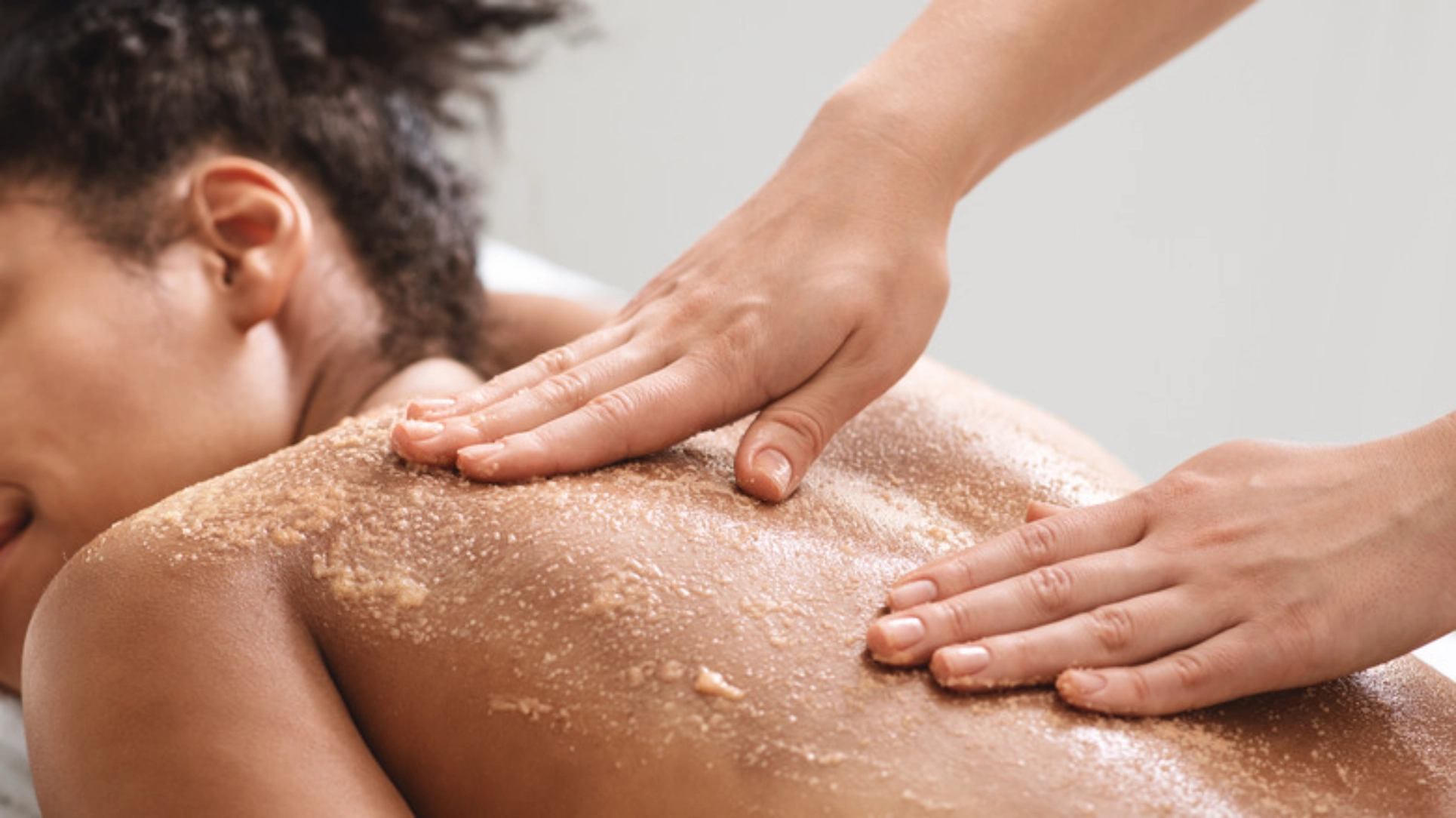 Spa exfoliation treatment for glowing, smooth skin.